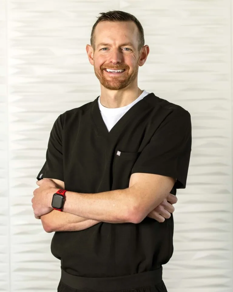 Dr. Addison Killeen smiling wearing a black scrub suit