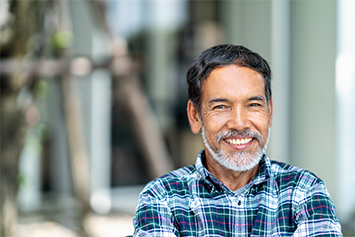 An older man smiling