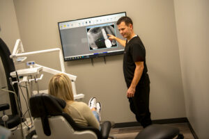 dr sean hershberger showing a patient an xray